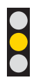 What does a solid yellow traffic light mean?